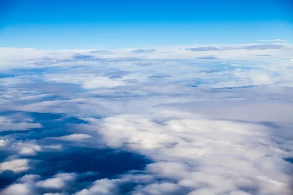 Beautiful, dramatic clouds and sky viewed from the plane — Stock Photo, Image