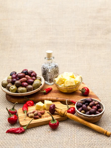 Composition with olive wood, olives, vinegar and spices with burlap texture — Stock Photo, Image