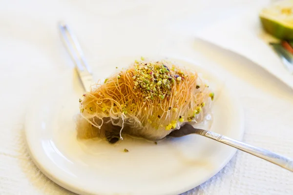 Kataif cake on a white plate — Stock Photo, Image