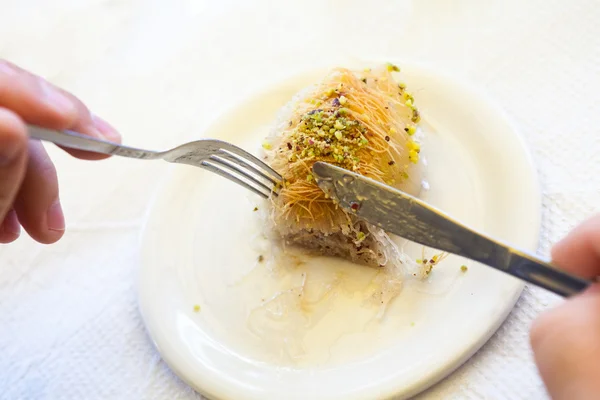 Kataif cake on a white plate — Stock Photo, Image