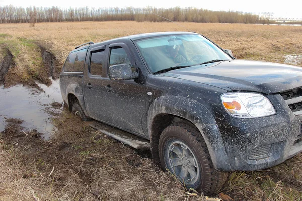 The car is stuck in the mud