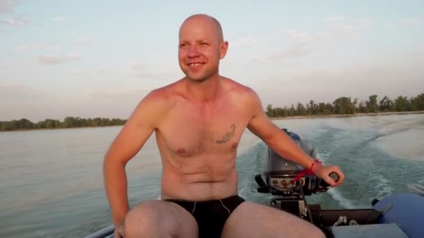 Happy Adult Man Sailor Drives Motorised Rubber Inflatable Boat Planing — Stock Video