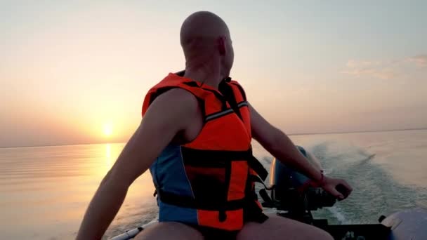 Happy Adult Man Life Jacket Drives Motorised Rubber Inflatable Boat — Stock Video