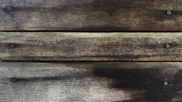 Fondo de madera marrón gris viejo hecho de tablas horizontales naturales con clavos en estilo grunge. Vista superior. Textura cepillada cruda de pino de coníferas. Superficie de la mesa para disparar plano laico. Copiar espacio. —  Fotos de Stock