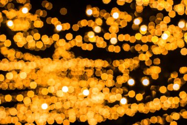 Siyah zemin üzerine altın pentagon bokeh