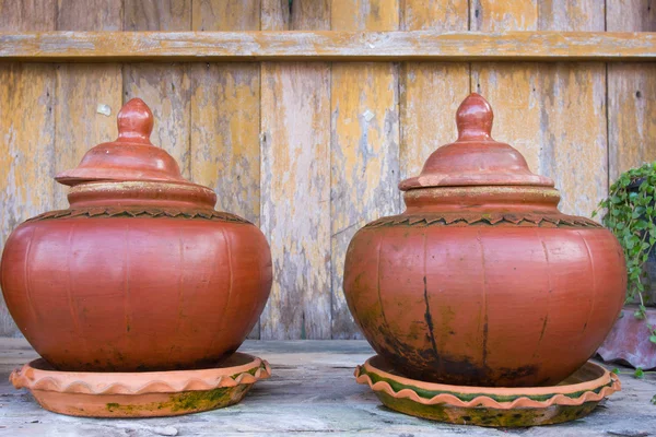 Clay pot on the wooden background — Stock Photo, Image