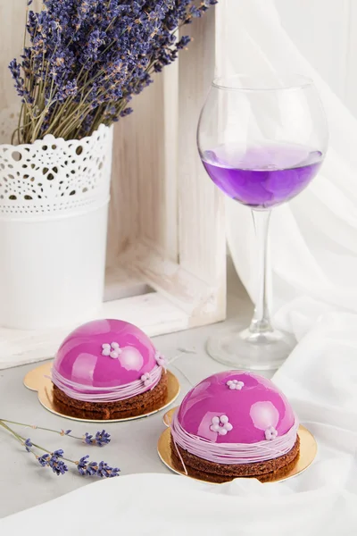 Lavender french mousse cakes with pink mirror glaze — Stock Photo, Image