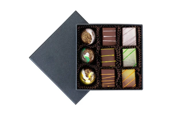 Assortiment Bonbons Luxe Avec Éclaboussures Colorées Dans Une Boîte Noire Images De Stock Libres De Droits