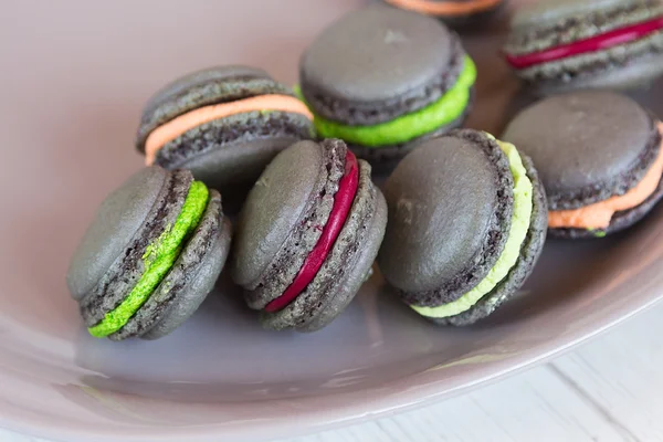 Gray macaroons with colorful cream — Stock Photo, Image