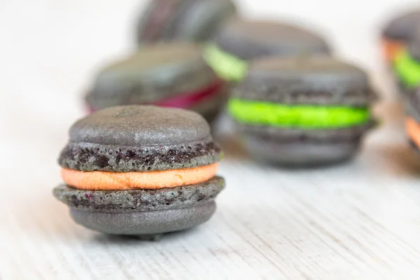 Gray macaroons with colorful cream — Stock Photo, Image