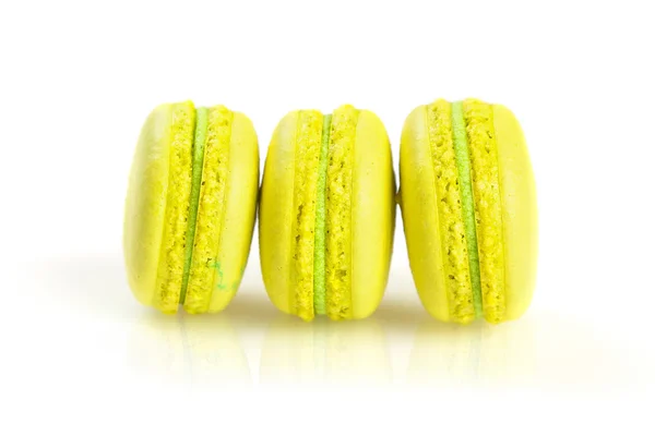 Yellow macaroons isolated on white, selective focus — Stock Photo, Image
