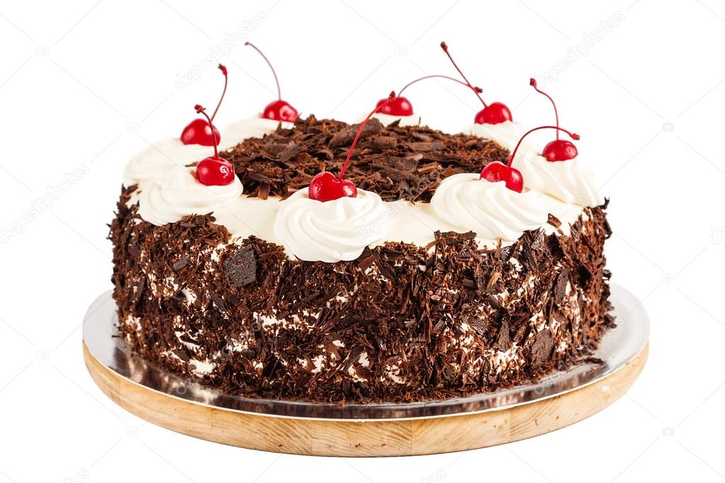 Black forest cake decorated with whipped cream and cherries