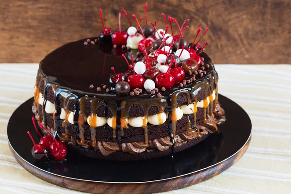 Layered chocolate cake with cherries — Stock Photo, Image