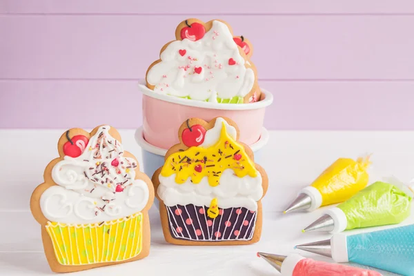 Colorful icing cookies in cupcake shape — Stock Photo, Image