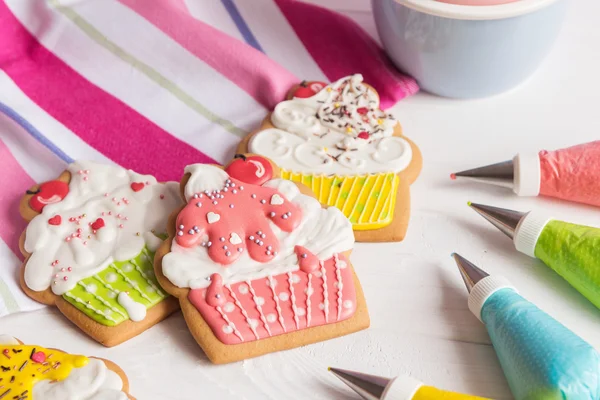 Colorful icing cookies in cupcake shape — Stock Photo, Image