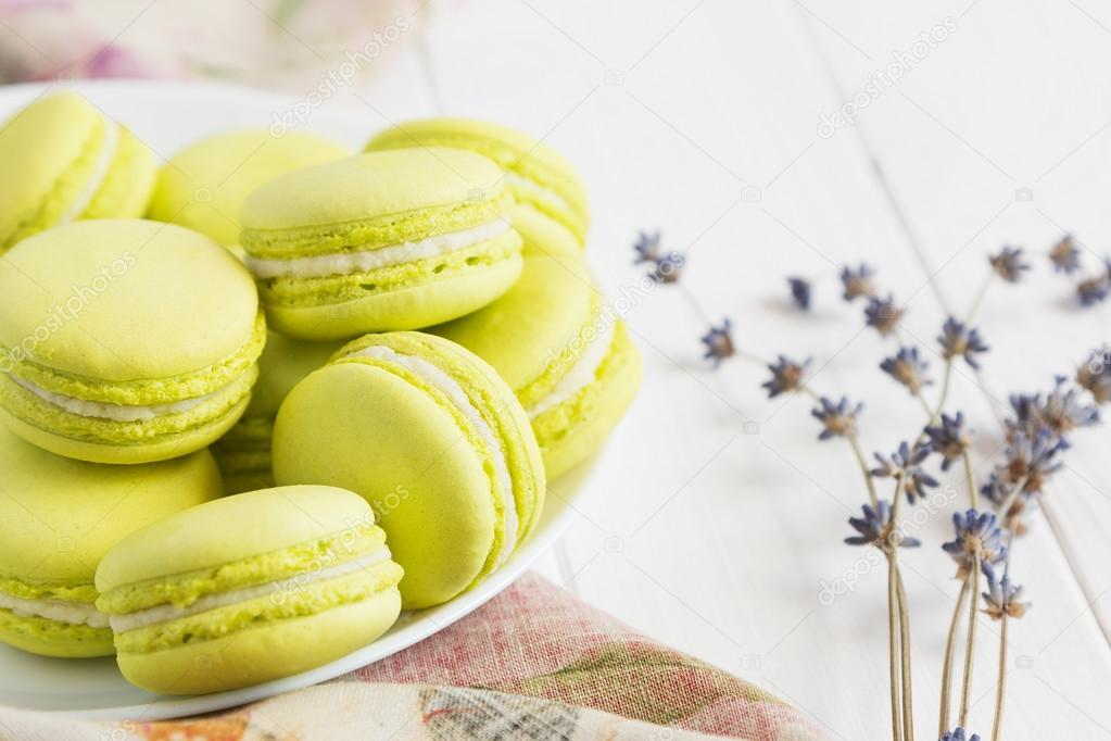 Close up green macaroons on white plate