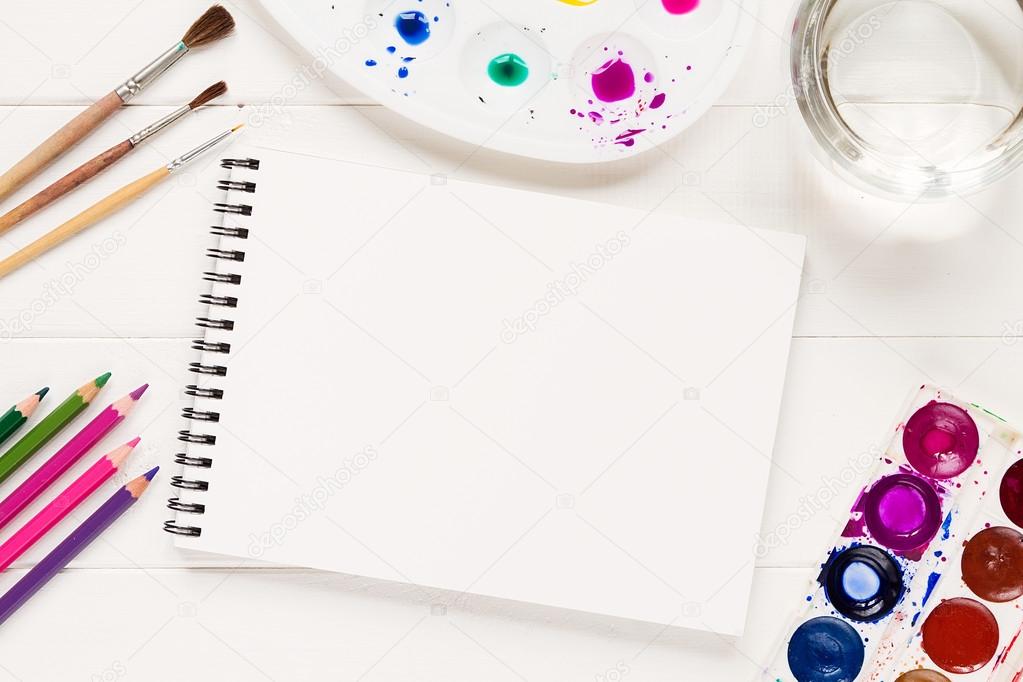 Mock up with artistic tools on white table