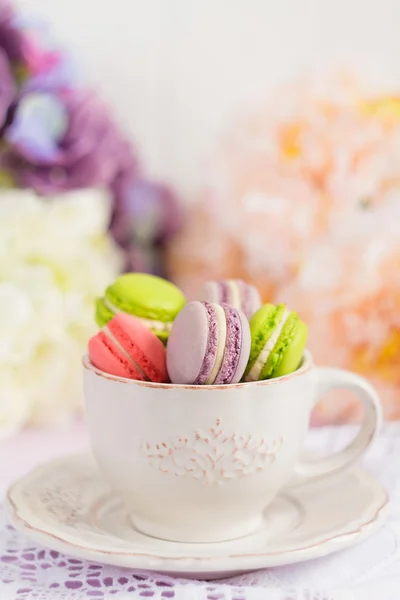 Colorful tiny macaroons in the cup — Stock Photo, Image