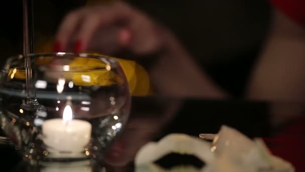 Female Hands with Red Nails Play with Melting Ice and a Photo of a Man — Stock Video