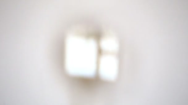 Proyección de una ventana a través de lupa — Vídeos de Stock