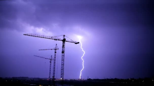 Stormy Sky and Lighnings over Night Construction — Stock Video