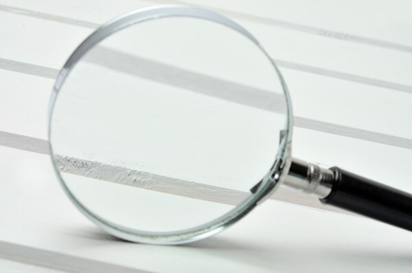 Magnifying glass on table