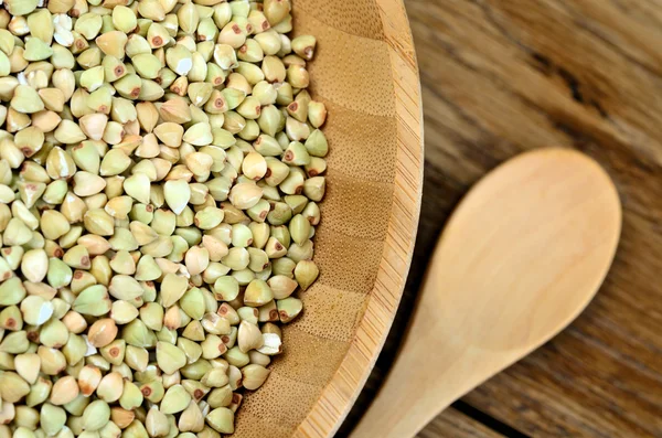 Healthy green buckwheat in a bamboo bowl — Stock Photo, Image