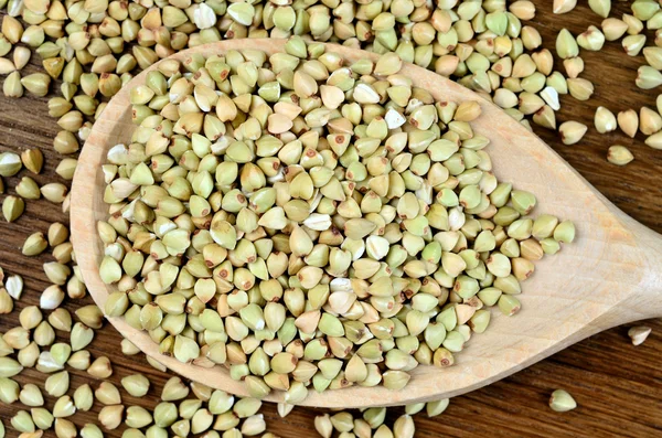 Healthy green buckwheat in a spoon — Stock Photo, Image