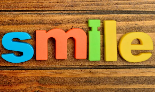 Smile word on table — Stock Photo, Image