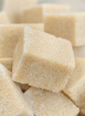 Arka plan üzerinde kesme şeker kahverengi