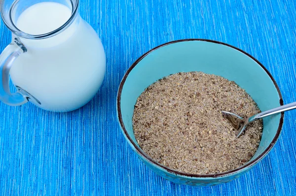 Bowl with bran and milk — Stock Photo, Image