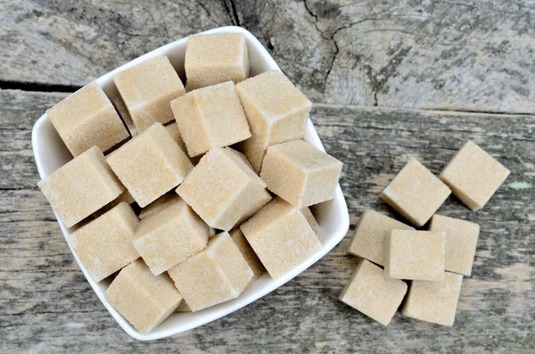 Beige sugar cubes in bowl — Stock Photo, Image