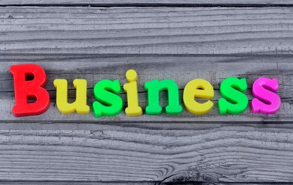 The word Business on wooden table — Stock Photo, Image