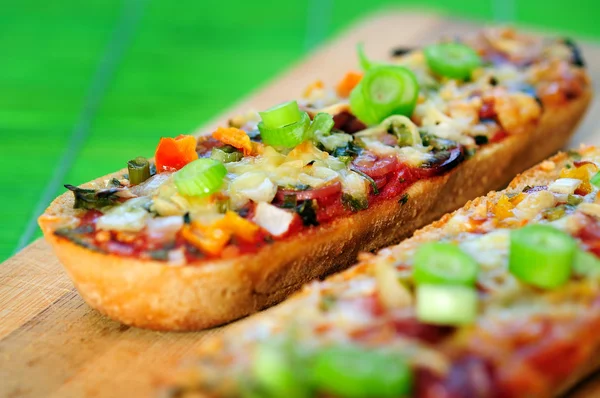 Bruschette with salami — Stock Photo, Image