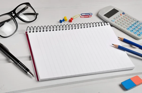 Notepad with office supplies — Stock Photo, Image