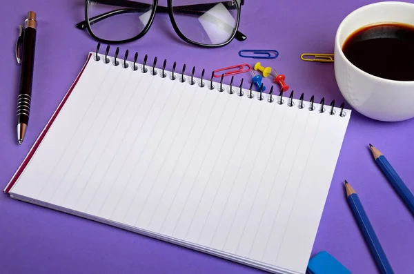 Notepad with office supplies — Stock Photo, Image
