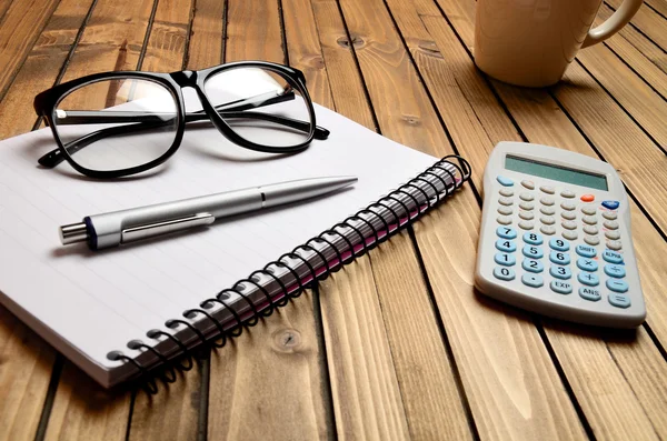 Notepad with office supplies — Stock Photo, Image