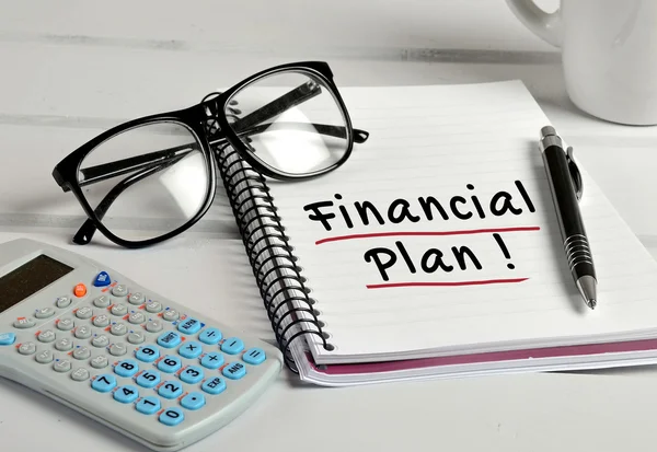 Financial Plan word on notebook — Stock Photo, Image