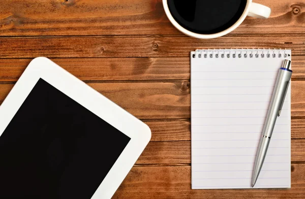 Tablet notepad and cup of coffee — Stock Photo, Image