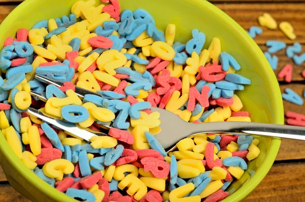 Bowl with colorful sugar letters — Stock Photo, Image