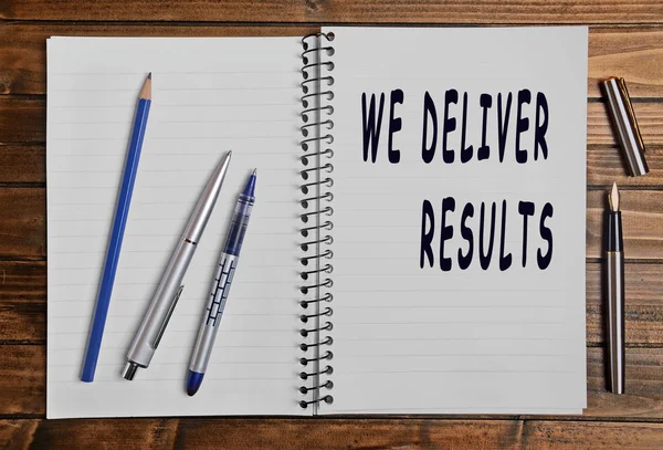 We deliver results text — Stock Photo, Image