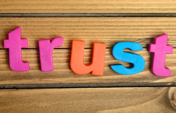 Colorful Trust word on table — Stock Photo, Image