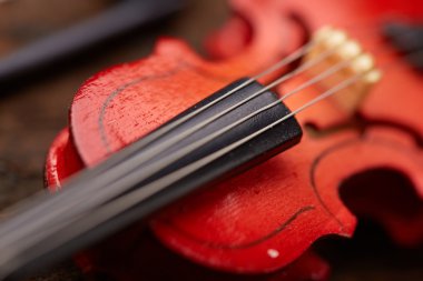 Violin on wooden background clipart
