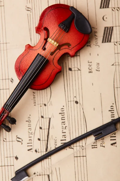 Violino su fondo note — Foto Stock
