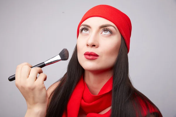 Beautiful woman correcting make-up — Stock Photo, Image