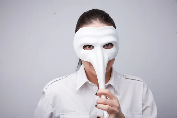 woman in white mask