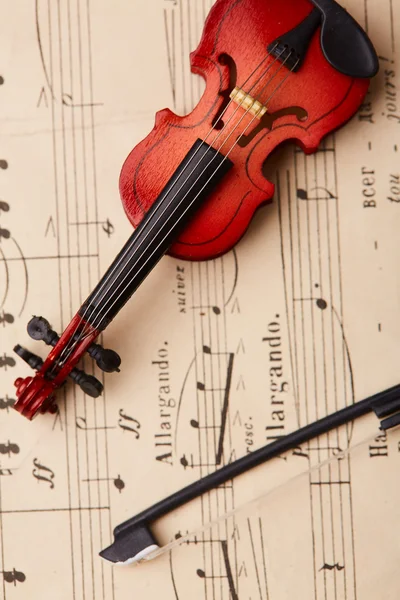 Violino su fondo note — Foto Stock