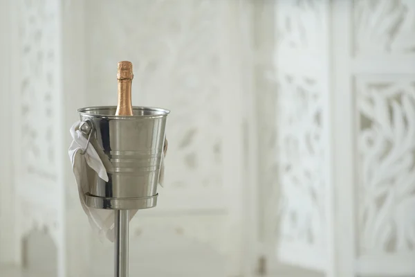 Champagne bottle in metal bucket