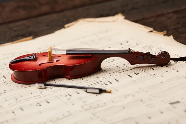 Violoncello on musical notes background