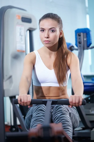 Pretty girl training at gym — Stock Photo, Image